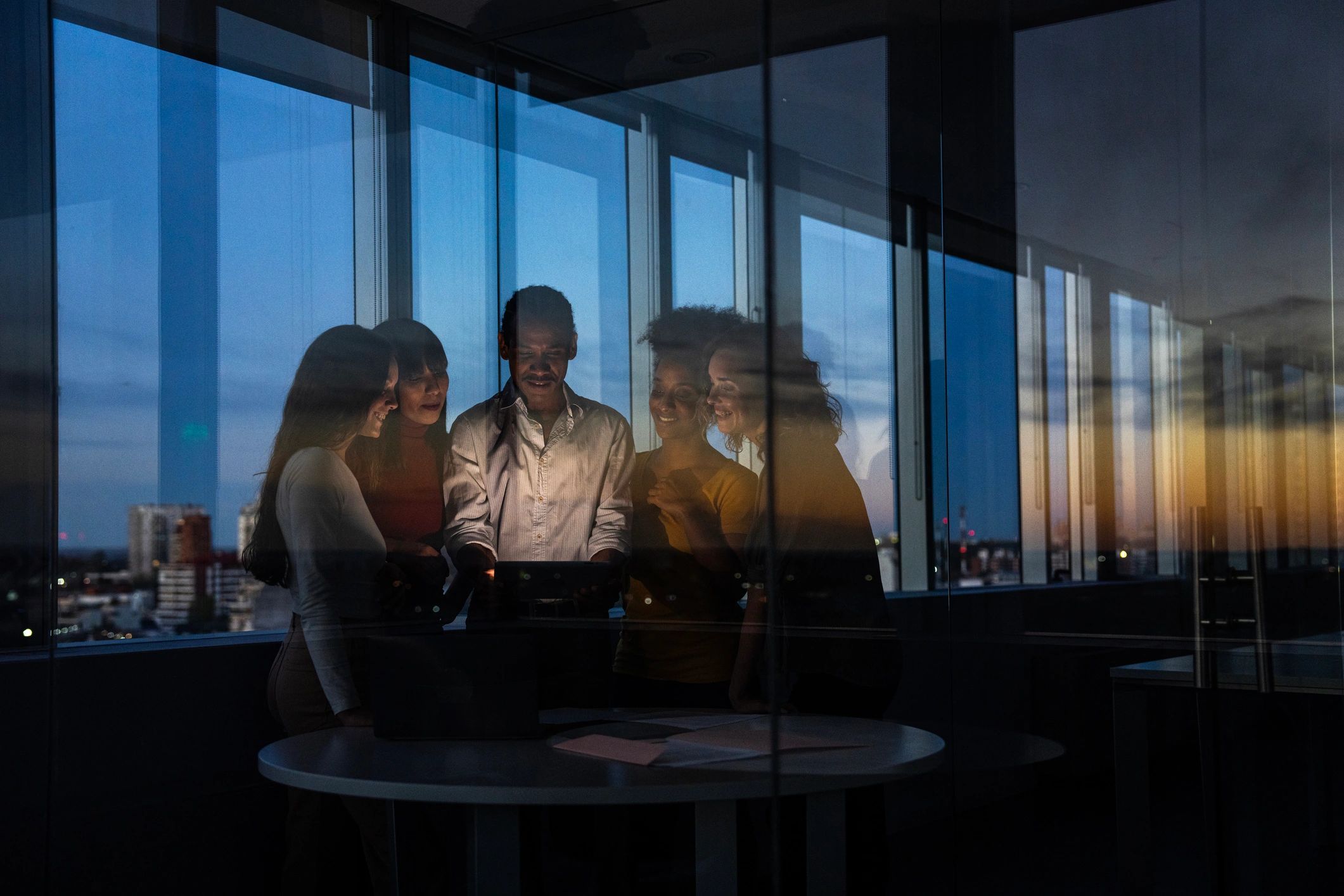 Group discussing property and finance decisions in an apartment setting