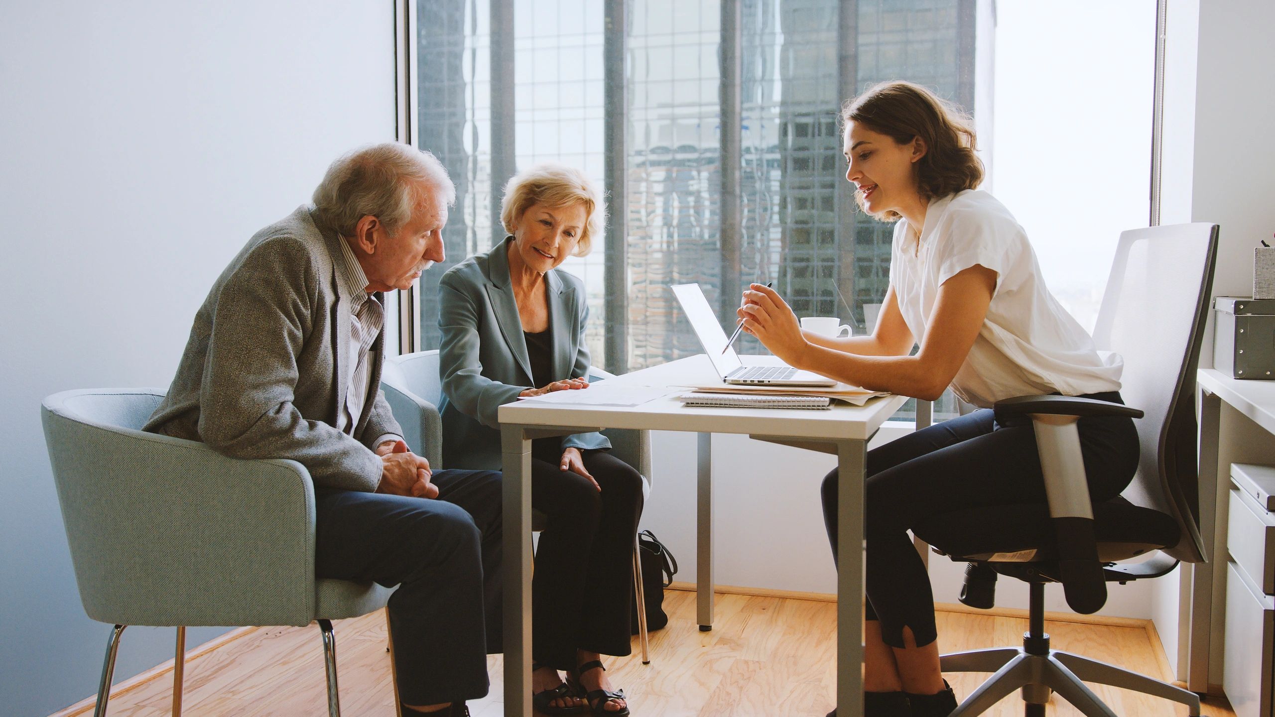 Investors meeting with a financial advisor about property strategy